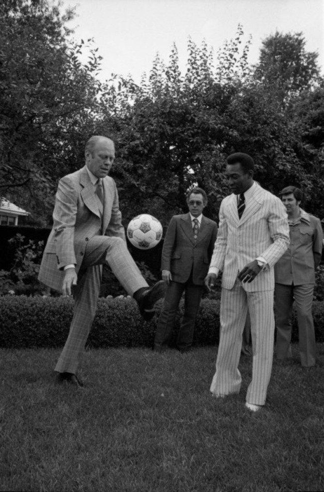 President Gerald R. Ford showing off his juggling skills to soccer legend Pele.