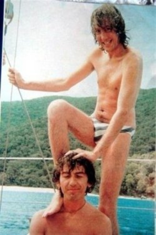 Eric Idle from Monty Python goofing off with George Harrison.