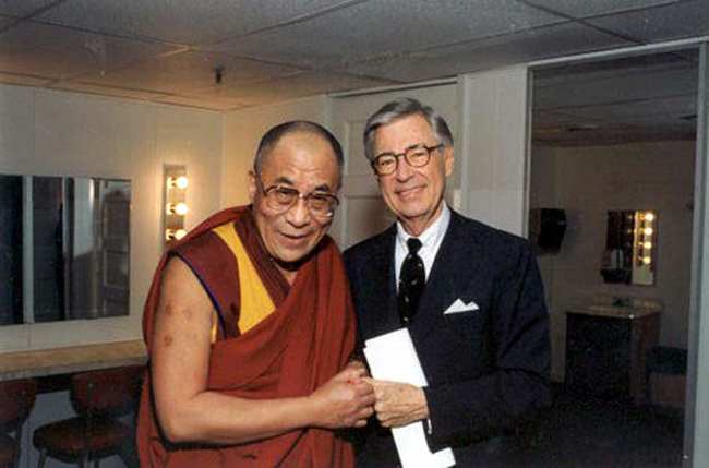 The Daili Lama and Mr. Rodgers sharing a fist bump.