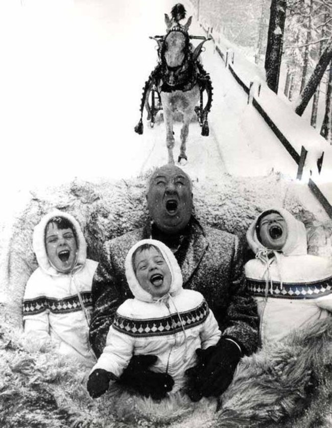 Alfred Hitchcock and his grandchildren enjoying a sleigh ride.