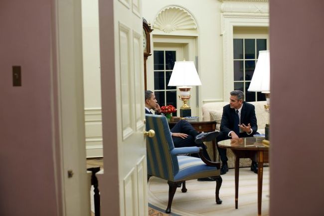 President Obama and George Clooney chatting in the oval office.