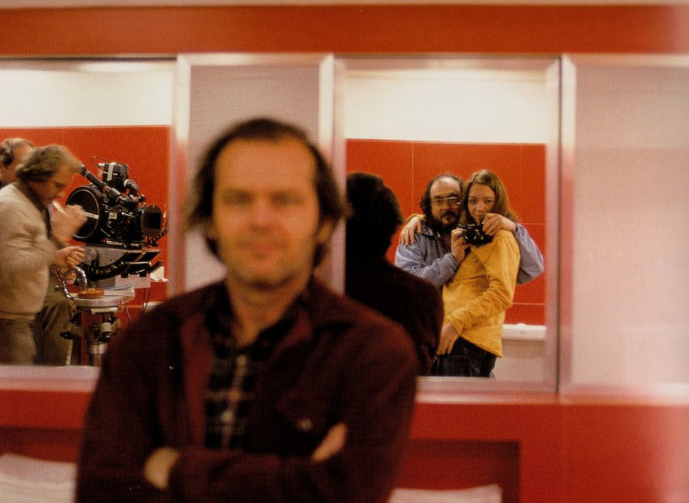 Stanley Kubrick sneaks a photo over Jack Nicholson's shoulder.