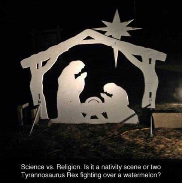 nativity scene - Science vs. Religion. Is it a nativity scene or two Tyrannosaurus Rex fighting over a watermelon?