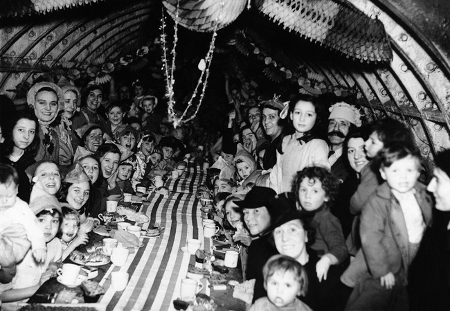Children in London celebrate Christmas in an underground bomb shelter. 1940