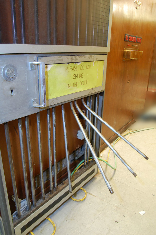 Once in the basement, they pried their way through this metal security door.