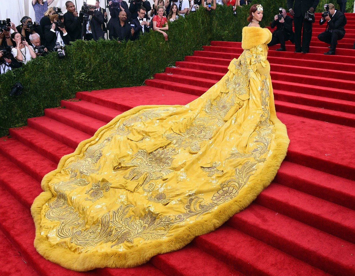 Making an entrance: Rihanna pauses on the stairs as she walks into the 2015 Metropolitan Museum of Art annual gala. She looks like she's dragging a big ass pizza dough.