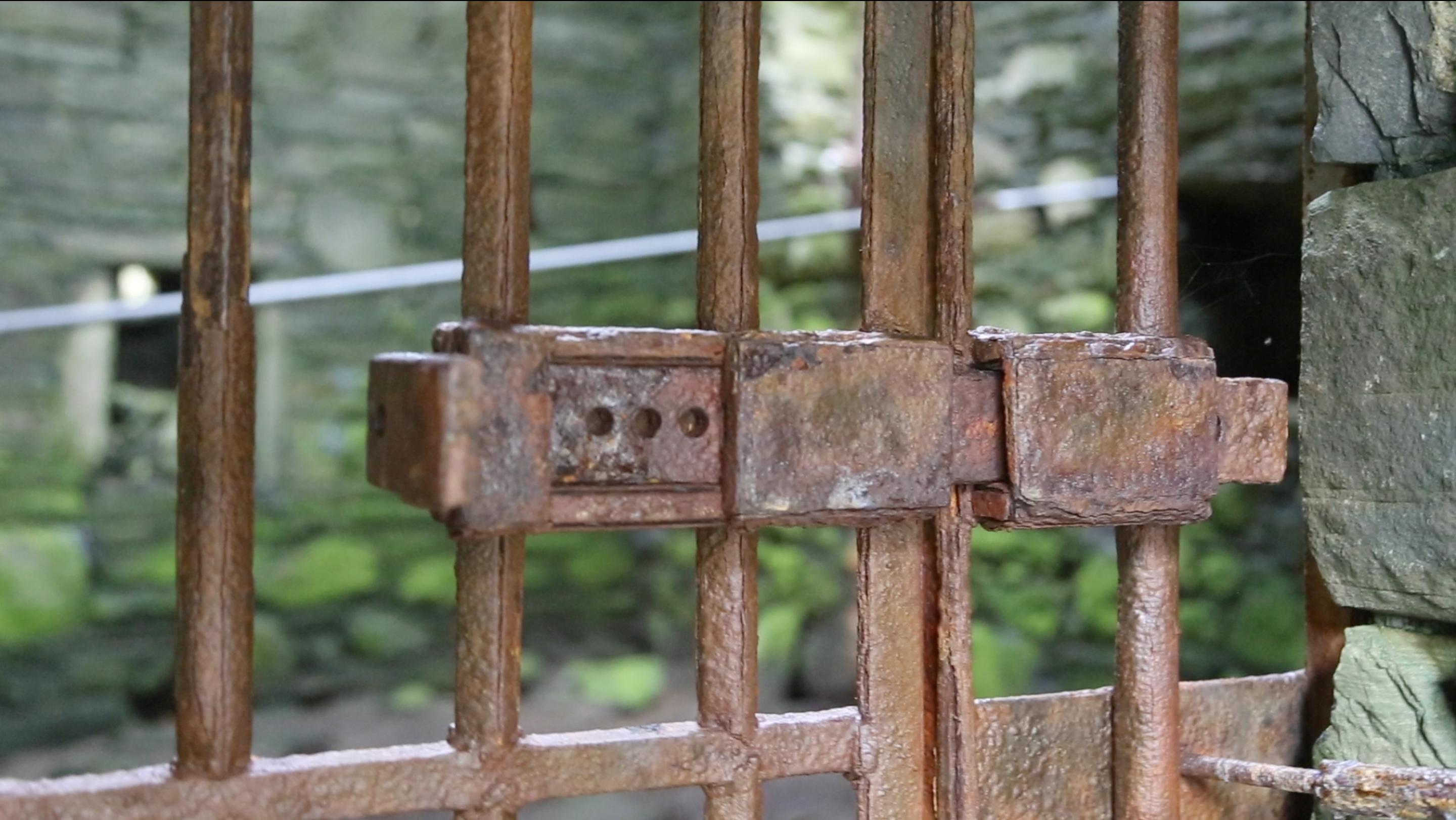 There was an elaborate rusted lock on the gate.
