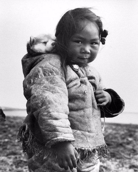 Little Eskimo and her husky, 1949.