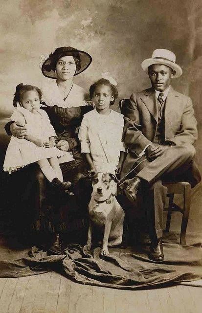 Vintage photo of African American family with their dog, 1910.