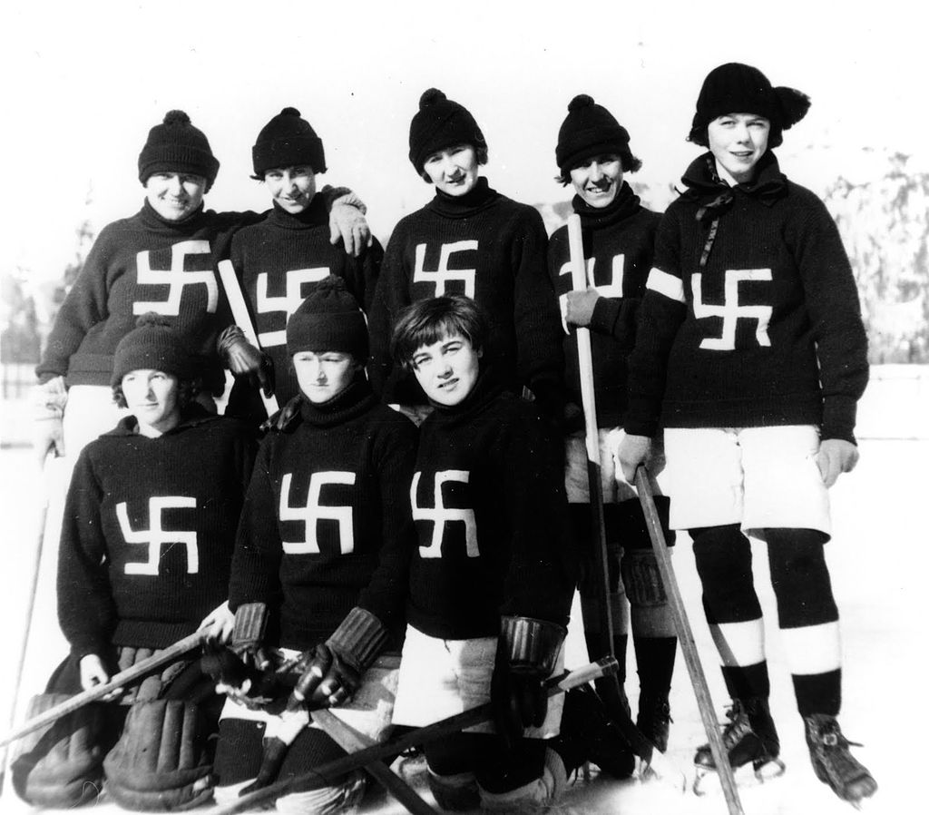 The Fernie Swastikas hockey team taking a group picture in British Columbia, wearing sweaters with their team logo.