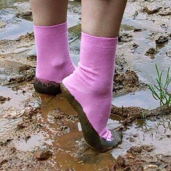 pink socks in mud