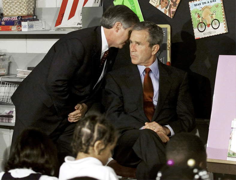 President Bush receives word of the September 11th attacks while visiting a Florida classroom.