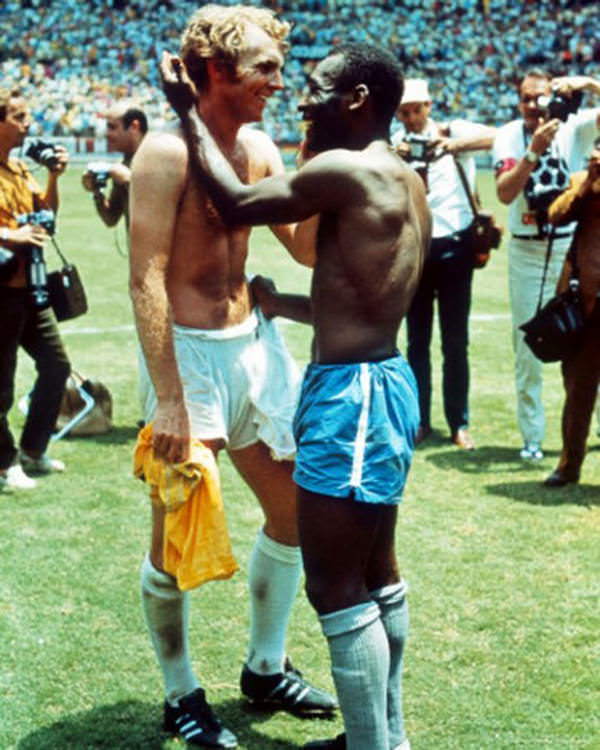 Bobby Moore embraces Pele at the 1970 World Cup finals.