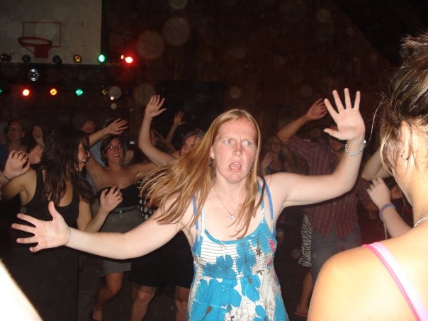 Some crazy girl either isn't enjoying the music, or has a strange way of dancing