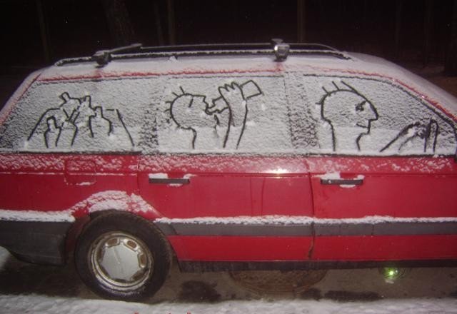 Someone drew a buch of people drinking beer in the windows of a car covered in snow