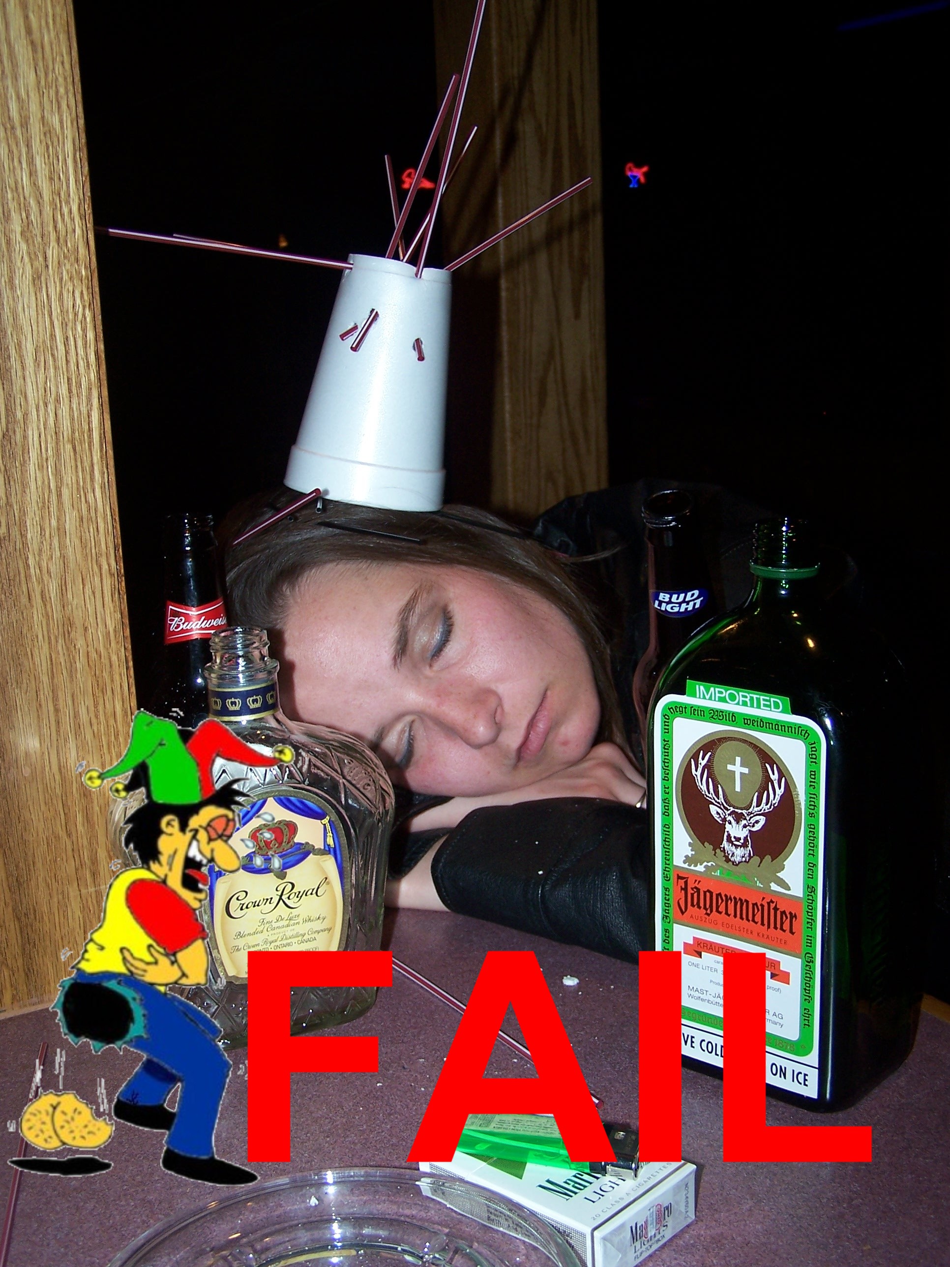 Girl passed out with stupid cup on her head.