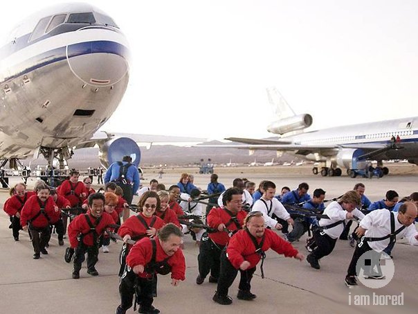 how many midgets it takes to haul a plane!