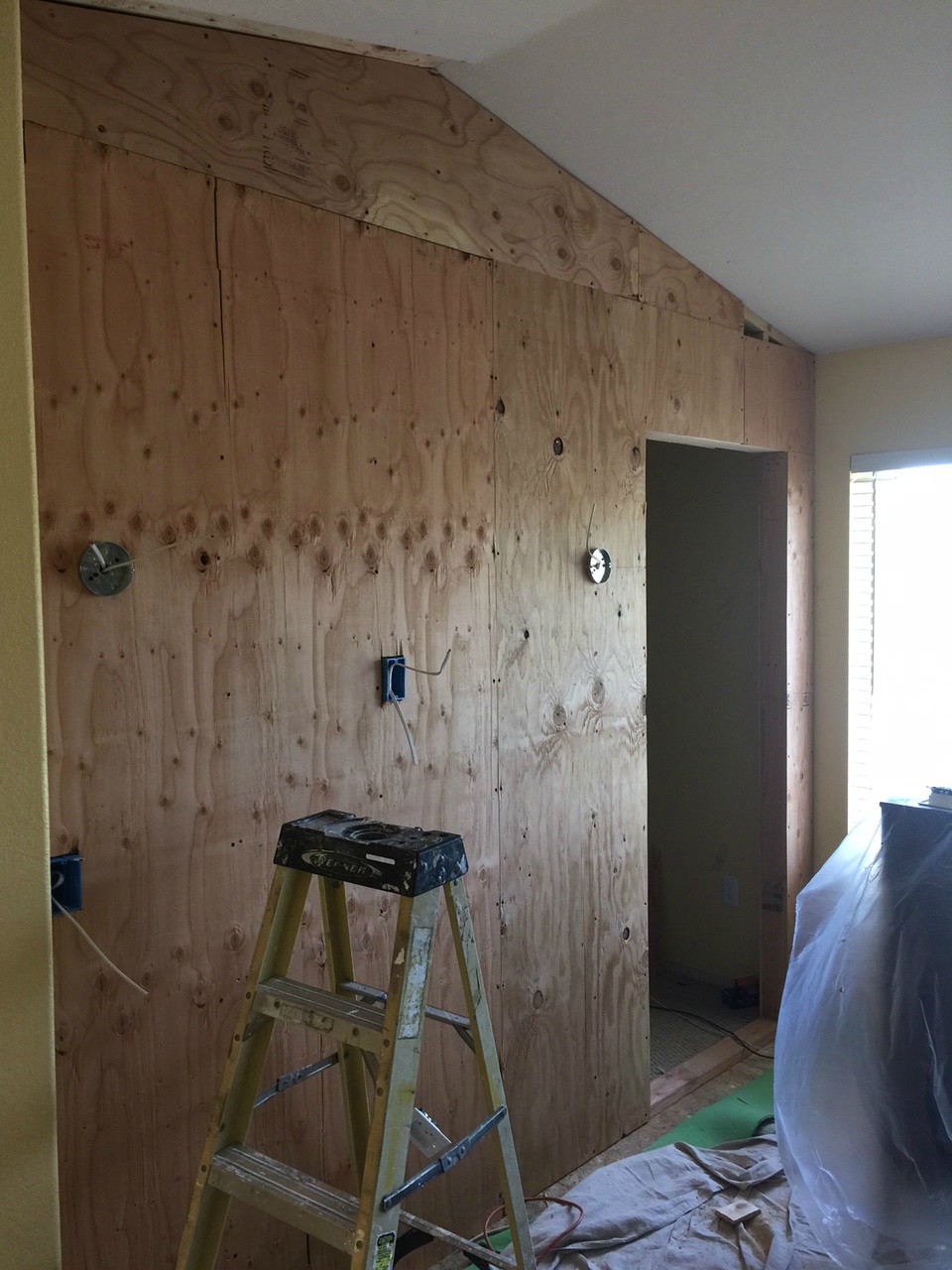 Cover up the part you want to be your new wall. Use high quality plywood.