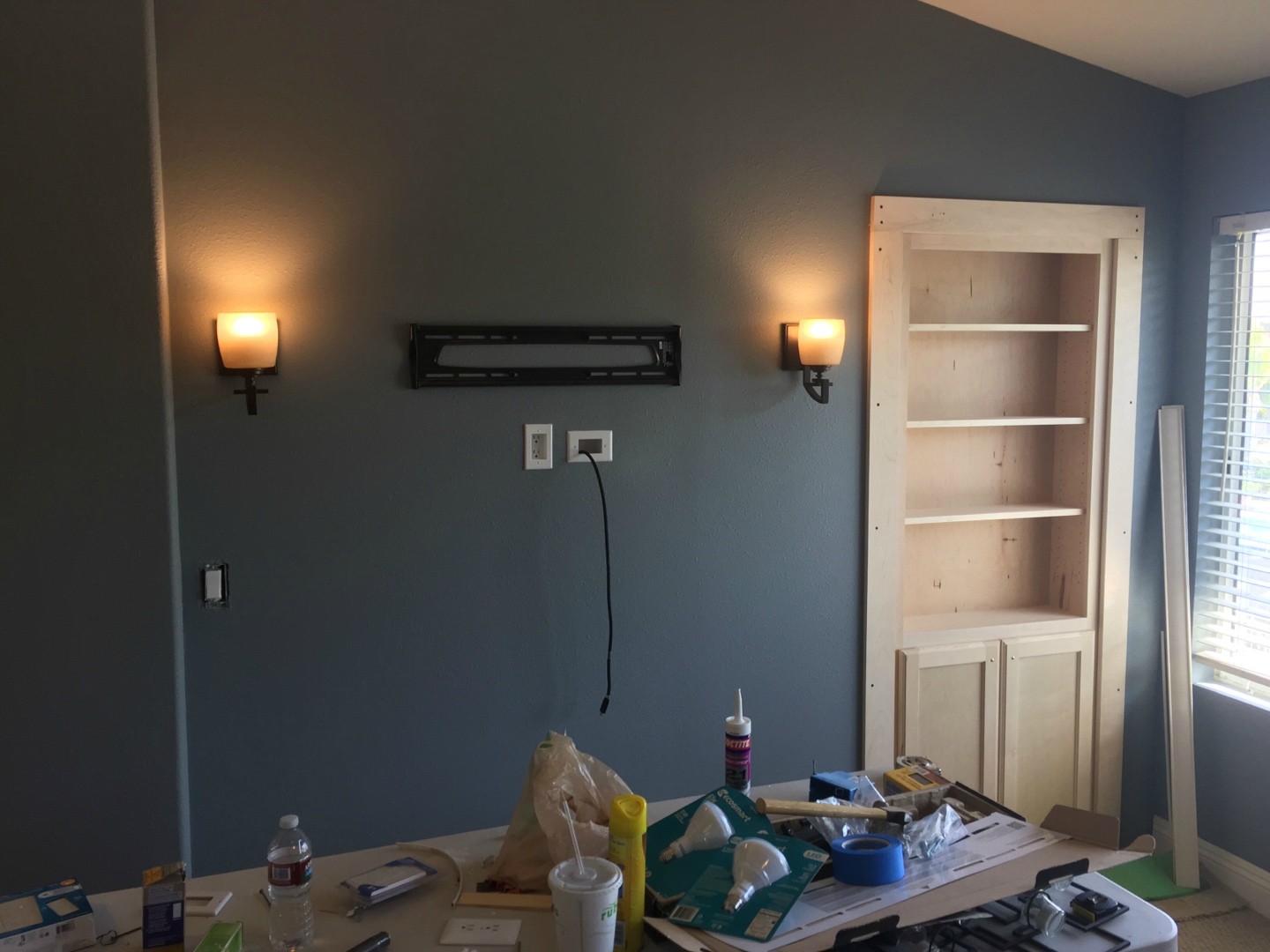 A bit of a paint job and the wall is pretty much done. What you need is a secret passage door disguised as a shelf.