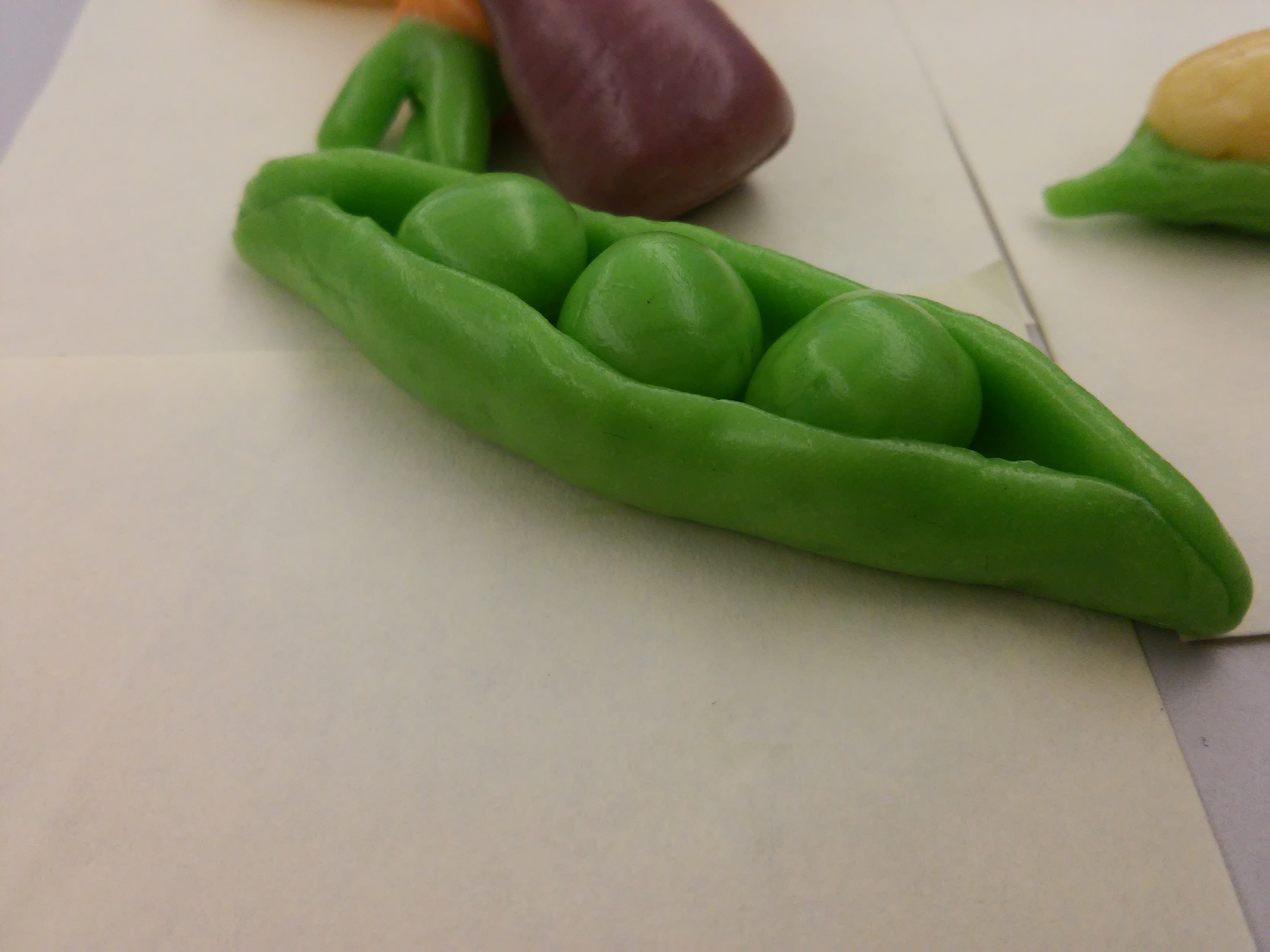 In an effort to step it up, the sculpture of the peas shown previously created a pod to house the peas.