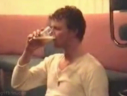 gifs - man drinks then spits it back into the cup