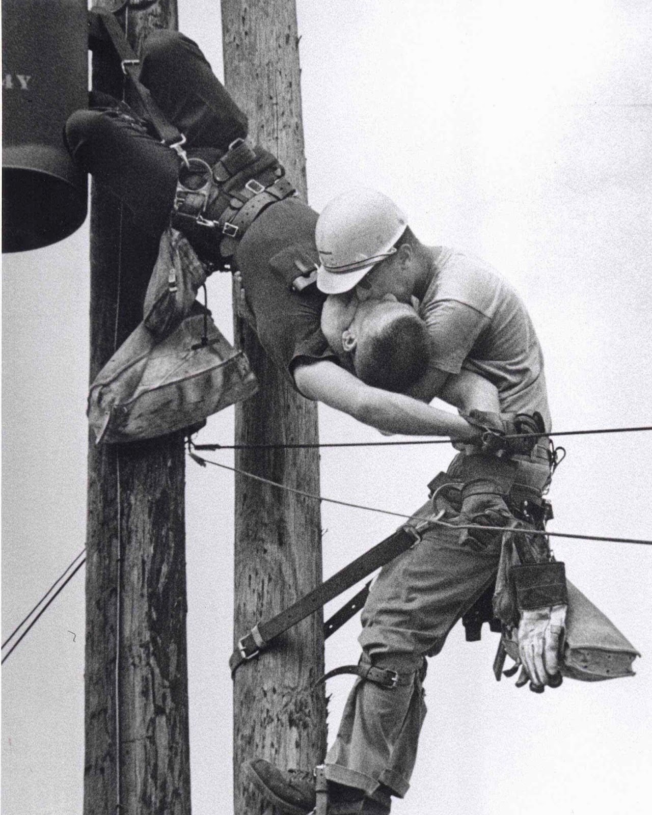 A worker gives his co-worker mouth-to-mouth after he touches a high voltage wire in 1967.