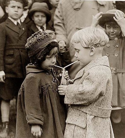 Two kids share a soda at the Whitehouse Easter Egg Roll in 1922.