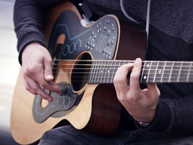 The simple attachment that turns your acoustic guitar into an electronic orchestra.