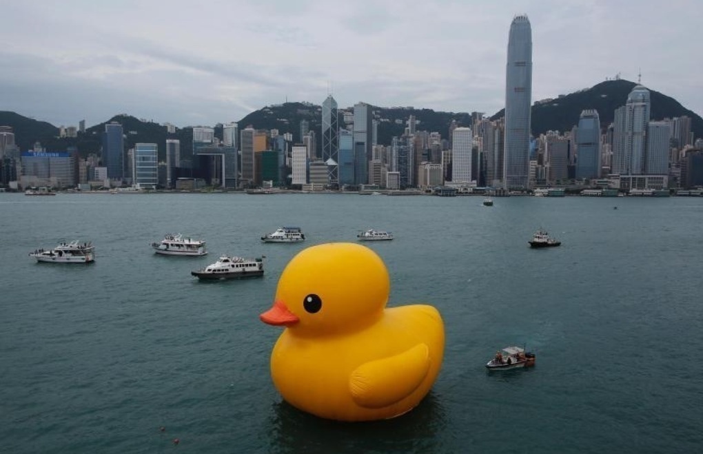 A giant rubber ducky going for a swim.