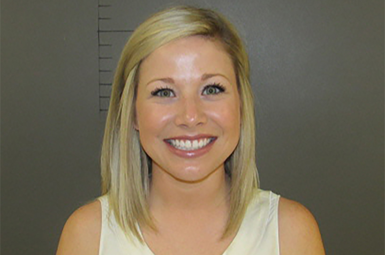 Married Texas teacher Sarah Fowlkes couldn’t wipe the smile off her face for her mugshot after being accused of having sex with a 17-year-old student, the Houston Chronicle reported.