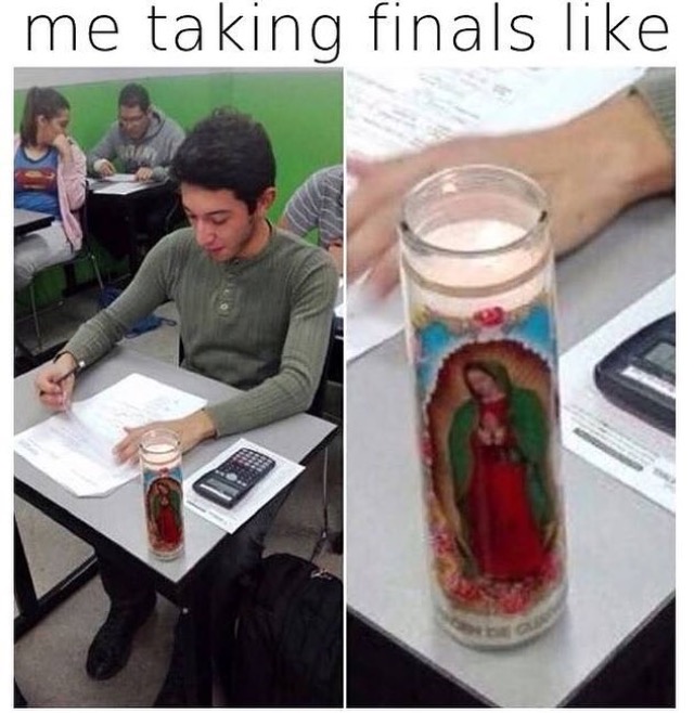 funny picture of someone taking finals with a candle of Jesus on the desk