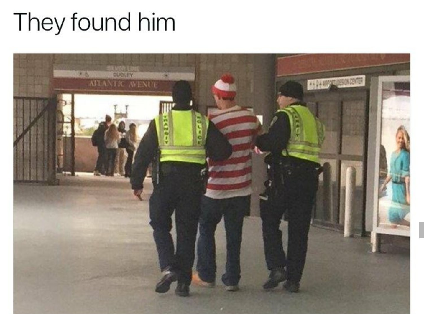 Police arresting someone that is dressed like Where's Waldo