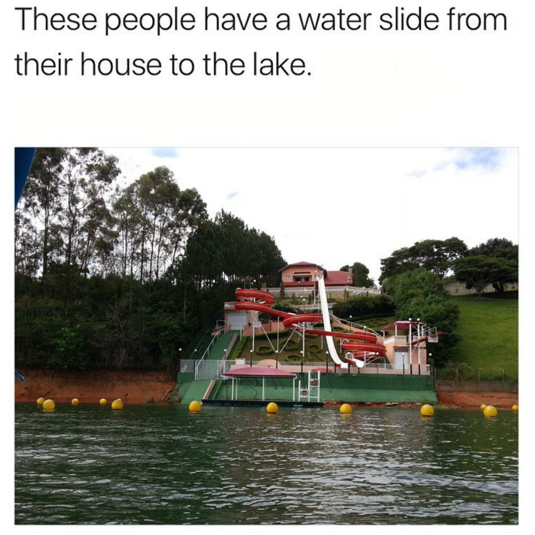 lake house with water slide - These people have a water slide from their house to the lake.