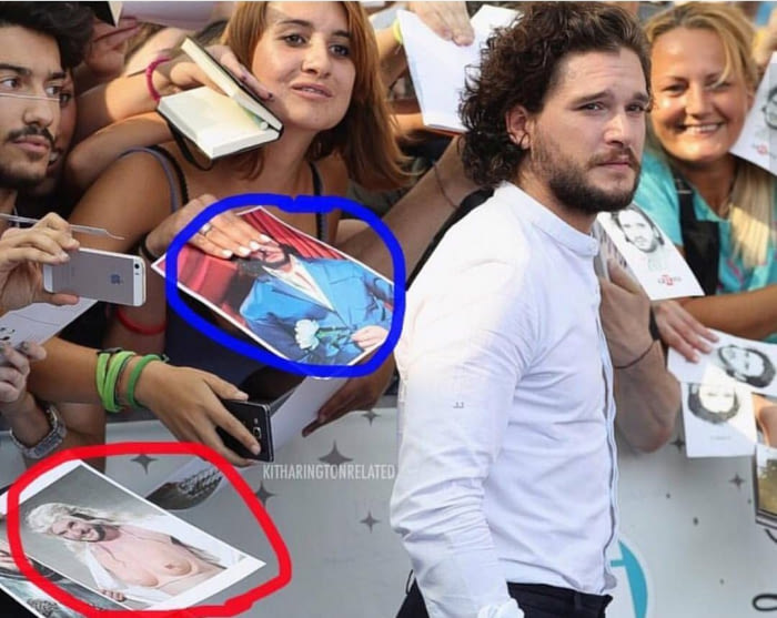 Kit Harrington being flocked by fans for an Autograph and one of them is a pic of him on a woman's body.