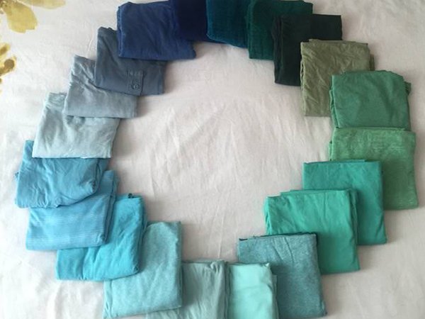 Buy 365 near identical, solid color shirts that range through the entire color spectrum in a loop. It will appear as though you wear the same color shirt every day, but in photos from previous months you’ll be wearing a completely different color.