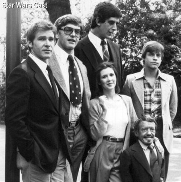 Circa A New Hope. Back row: Harrison Ford, Dave Prowse, Peter Mayhew, Mark Hamill. Front: Carrie Fisher, Kenny Baker.