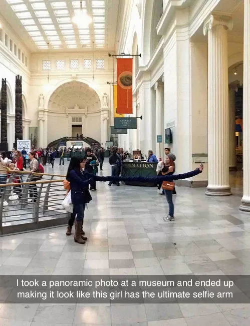 Funny picture snapchat of panoramic pic in a museum that makes a woman's selfie look like a real long arm.