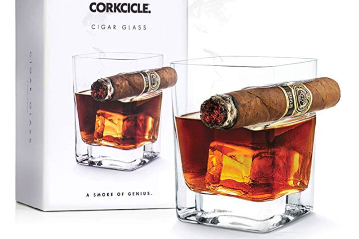 Drink your scotch, whiskey, or bourbon while enjoying your favorite cigar like a truly refined sir with this Corkcicle Cigar Glass, Double Old Fashioned Glass With Built-In Cigar Rest - $24.99 Get it <a href="https://amzn.to/2Tre7zp" target="_blank" rel="nofollow"><font color="red"><b>HERE</font></b></a>.