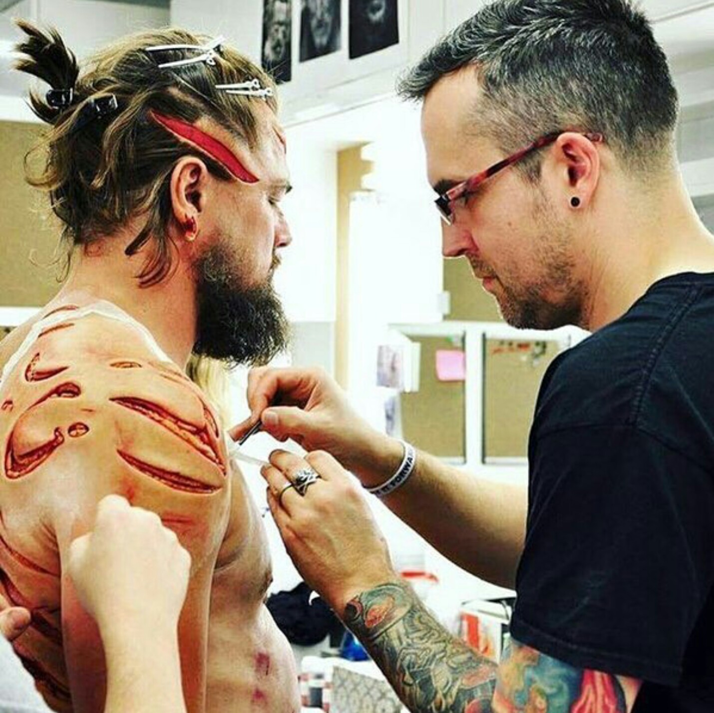 Leonardo DiCaprio getting prosthetic wounds and makeup applied during the filming of The Revenant.