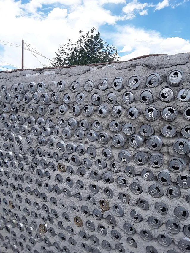 This concrete wall is partially made with aluminum cans.