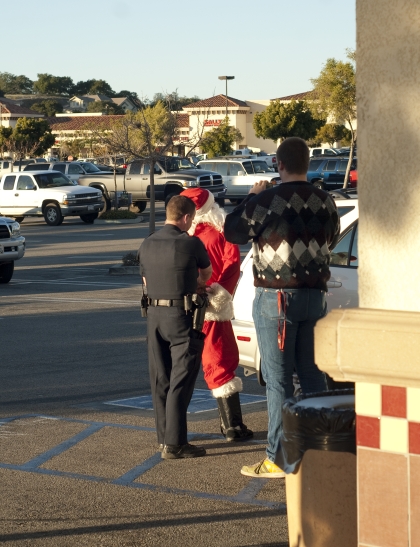 got a shot of this Santa getting arrested outside of a Starbucks,  don't know what for but it made my day.