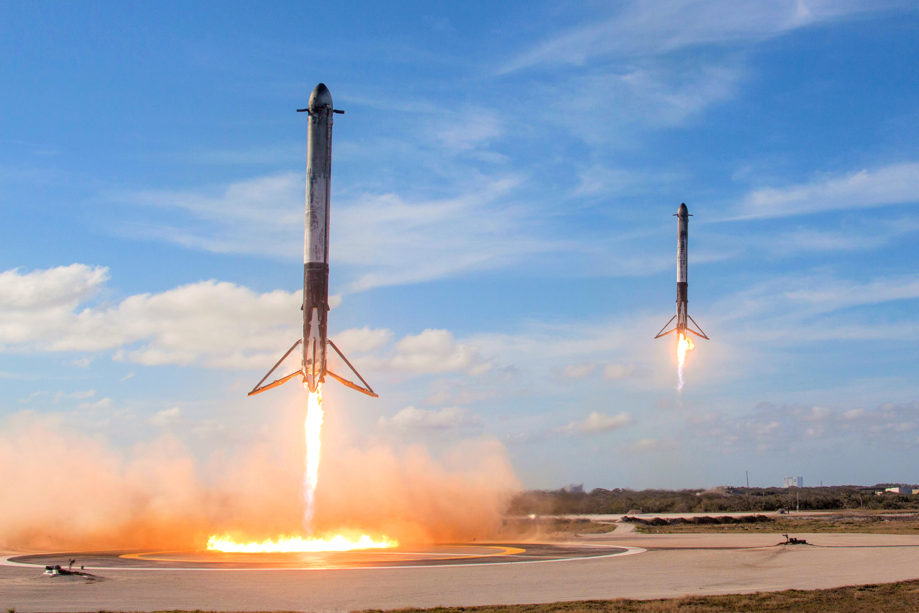 Two booster from the Falcon Heavy landing themselves back on earth  via "autopilot" a first for the world of space travel.