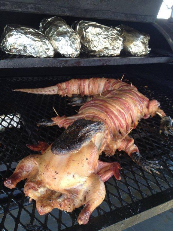A Bacon-Wrapped Alligator With A Chicken In Its Mouth