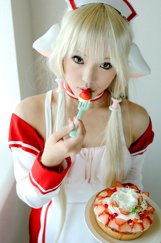 A girl at a cosplay event - can I have some of those strawberries?