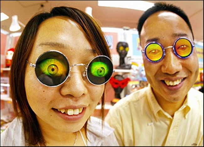 2 happy Asian people sporting some awesome glasses