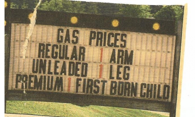 This is a real sign advertising the prices of gas at a gas station
