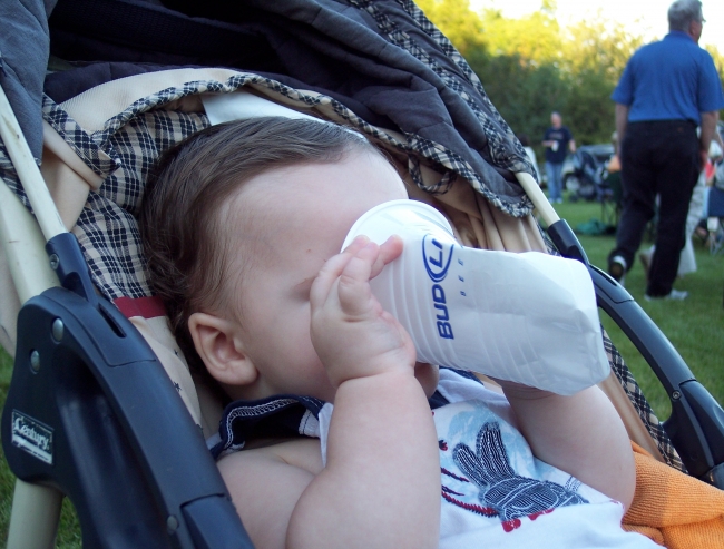 Baby drinking Bud Light. Parent of the year!!