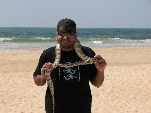 While on vacation, I like to play with my snake.