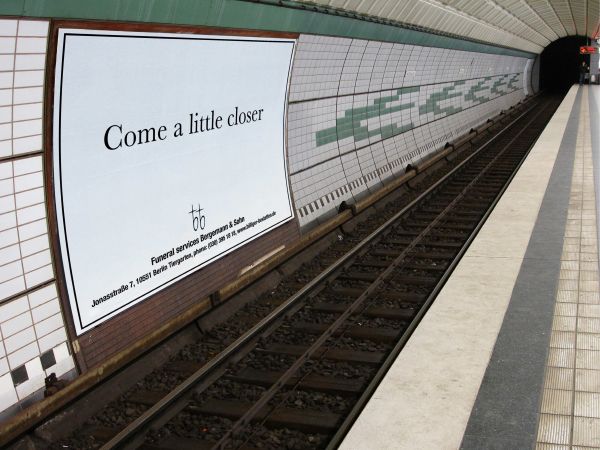 An ad for funeral services in the subway.