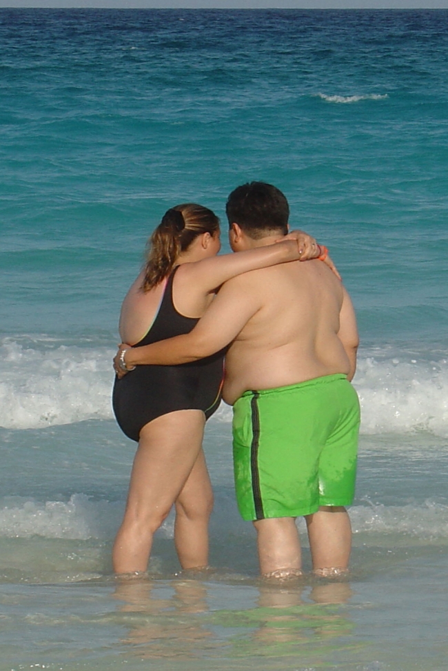 Two pleasently plump people  livin' large in love.